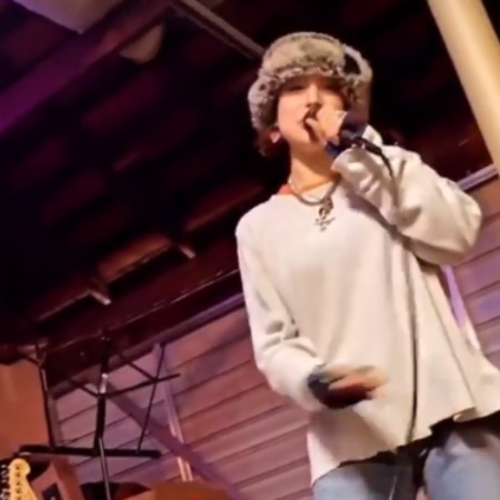 Valentine Rocky Adlon is singing whole-heartedly.